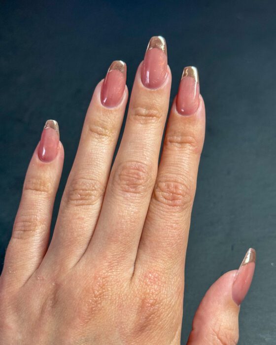 The same set against a blue-grey background, showing the mirror finish on the tips.