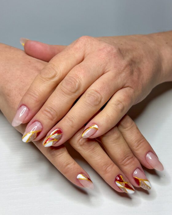 Gold-Line Geometry on Nude Almond Nails