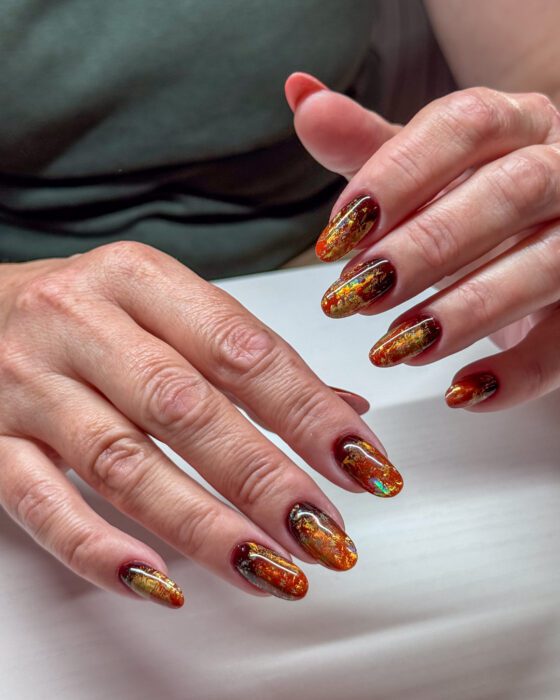 Side angle of the same autumn set, dark wine edges transitioning into copper and gold.