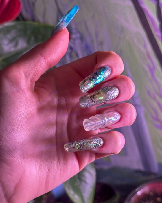 The same aquarium set, transparent nails shown beside the stronger turquoise ones.