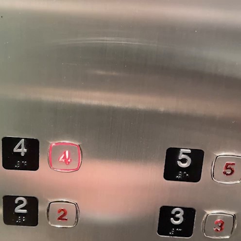 Elevator button panel with the button for floor 4 lit.